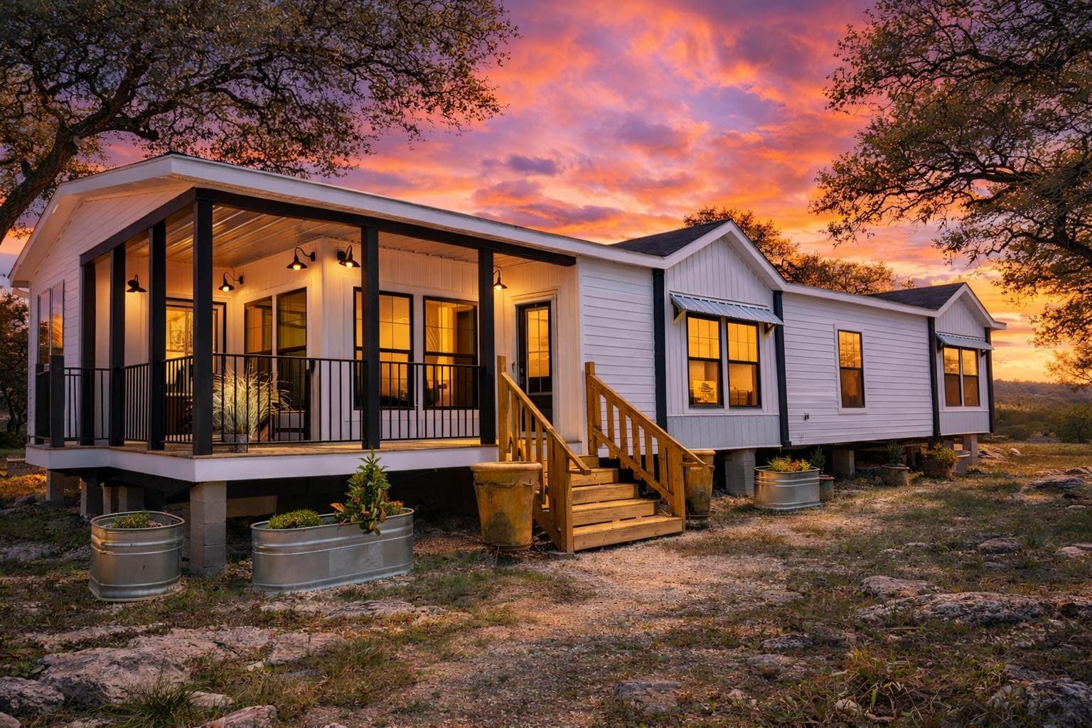 Doublewide manufactured home with wraparound porch at sunset in Texas